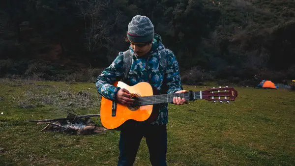 camper with guitar