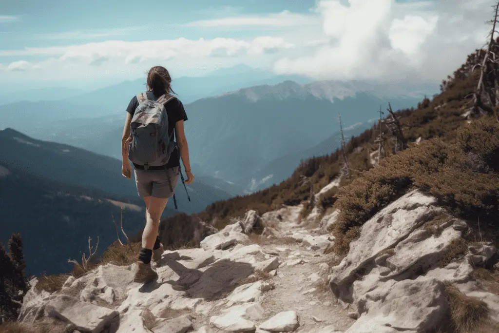 person hiking in mid cut hiking boots