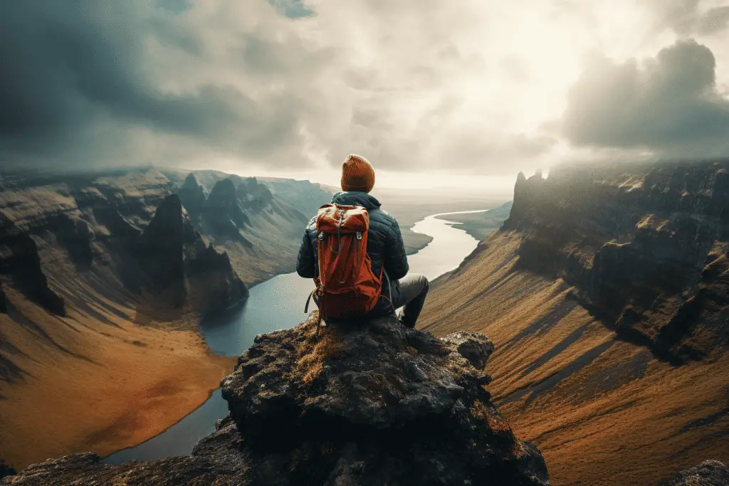 guy at summit of cliff camping spot